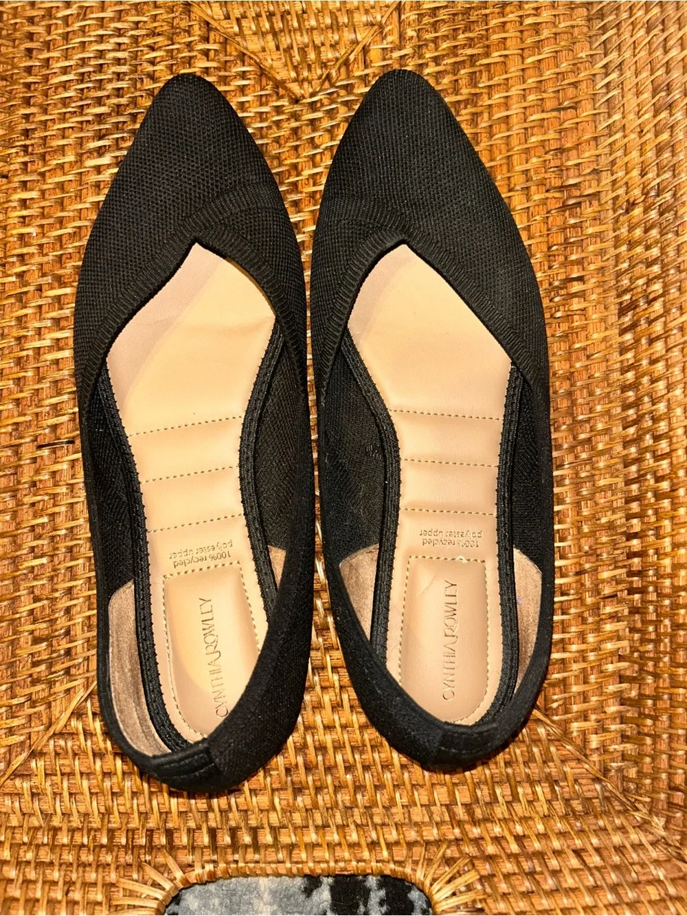 black Cynthia Rowley ballet flats with a pointed toe and a knitted upper